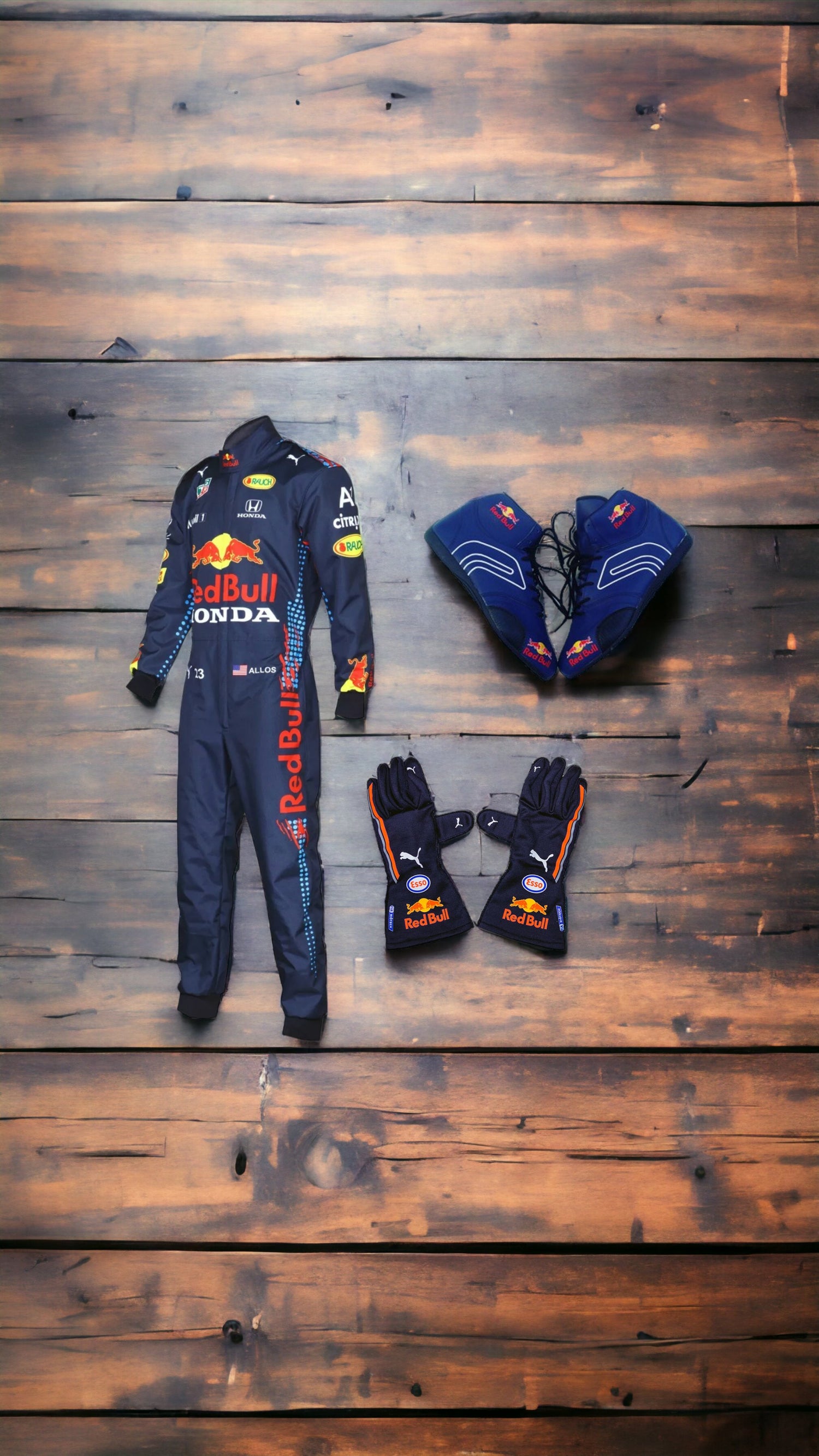 A red and black karting suit with white racing stripes, made of lightweight and breathable material. The suit features sponsor logos and has a tailored fit for maximum comfort and flexibility.